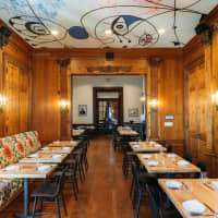 <p>Goosefeather opening in the Tarrytown House Estate on the Hudson has four dining rooms, with an art deco aesthetic, adorned by replicas of Miro murals painted on the ceiling.</p>