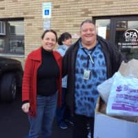 <p>Grace Brockel of the Center for Food Action stands with Forum School teacher Joseph Dietzold.</p>
