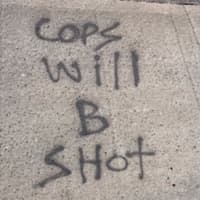<p>Authorities are searching for an individual or individuals who spray-painted messages threatening police and their families on Long Island.</p>