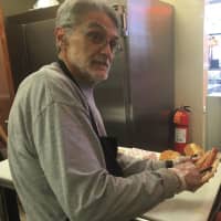 <p>Co-owner Greg Pappas cooking &quot;Super Dogs&quot; – one pound hot dogs from Union Pork Store in Union</p>