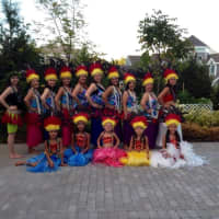 <p>The dance troupe lines up for a group picture. </p>