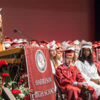 <p>Ella Eisinger, a commencement speaker chosen by Harrison High School&#x27;s faculty, addresses her peers. She plans to attend Stanford University in the fall.</p>