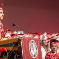 <p>Amr El-Aziz, a speaker selected by Harrison High School&#x27;s faculty, addresses his peers at the commencement. He plans to attend the University of Texas - Austin in the fall.</p>