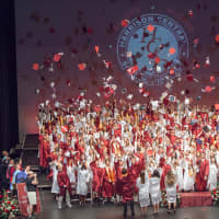 <p>Harrison High School graduates celebrate at the end of the 2016 graduation ceremony.</p>