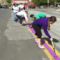 <p>Harrison High School will hold a Relay for Life event Saturday and Sunday to raise money for the American Cancer Society. To get ready, the have been painting the town purple.</p>