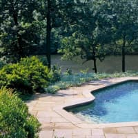 <p>The backyard features a pool, overlooking Tertia lake.</p>