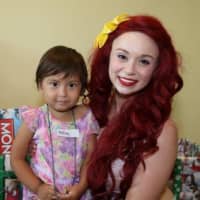 <p>Hailey Mendez, of West New York, visits with Ariel the Mermaid at the Christmas in July celebration at the Joseph M. Sanzari Children’s Hospital.</p>