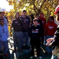 <p>Stepinac baseball players partake in Habitat for Humanity project in Yonkers. Here, they are being briefed about the scope of the project by foreman Steve Biolsi.</p>