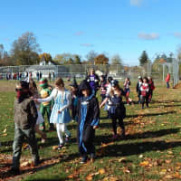 <p>Cottage Lane Elementary staff and students show off an array of costumes on Halloween.</p>