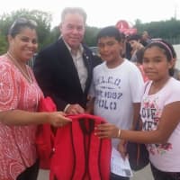 <p>Shown at last year&#x27;s backpack event in Haverstraw are, from left, Emily Dominguez, chairwoman of the Haverstraw Neighborhood Fund; Rockland County Executive Ed Day; and two unidentified schoolchildren.</p>