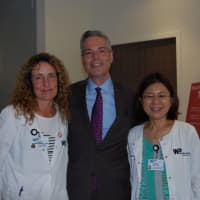 <p>White Plains Mayor Tom Roach with WPH holistic nurses Nancy Perseley and Toyoko Yasui</p>