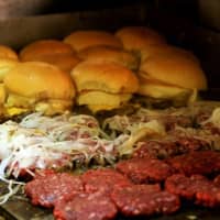 <p>Here&#x27;s a grill-full of burgers in the works at White Manna.</p>
