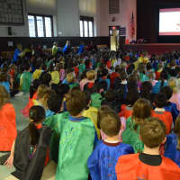 <p>Students at Daniel Warren Elementary School learn about being community heroes at a Dec. 10 assembly.</p>