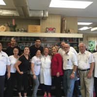 <p>Hillary Clinton, a Chappaque resident and frequent customer, poses with the owner and his employees at Lange&#x27;s Little Store &amp; Delivatessen Wednesday.</p>