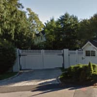 <p>Hillary and Bill Clinton fans can just get a tiny peek at their Chappaqua house over its white picket fence on Old House Lane. The property is guarded by the Secret Service.</p>