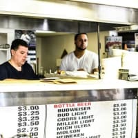 <p>Working the counter at Hiram&#x27;s Roadstand in Fort Lee, N.J.</p>