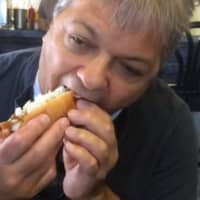 <p>It&#x27;s down the hatch with another chili and onion covered dog at Hiram&#x27;s Roadstand in Fort Lee.</p>