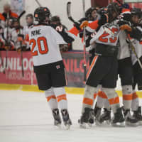 <p>Tiger hockey players celebrate a score against Suffern on Sunday, advancing in Division 1 playoffs.</p>