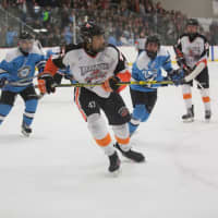 <p>Tiger hockey players advancing down the ice and up in Division 1 playoffs this weekend.</p>