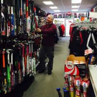 <p>Steve Colombo, owner of Home Field Advantage, re-stocks baseball bats at the Pompton Lakes, N.J., sporting goods store.</p>