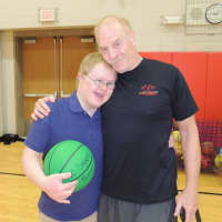 <p>Howie Berg, a Sports Buddies co-founder, meets one of the participants.</p>