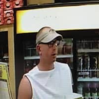 <p>Norwalk police are searching for a suspect (pictured above) involved in multiple thefts of lottery tickets.</p>