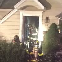 <p>Flames met responding firefighters in the stairwell and knee walls.</p>