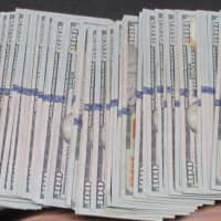 <p>Police have asked the public for information after a 75-year-old man sent more than $8,000 in cash to a Long Island home because he was targeted by scammers.</p>