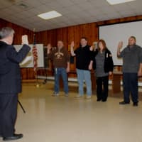 <p>Carmel Fire Dept. members take the oath.</p>