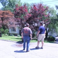 <p>Asst. Chief William Nikisher of the Mahopac Volunteer Fire Departments meets with Town of Carmel Building Inspector Mike Carnazza regarding the safety of the structure.</p>