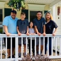 <p>Another family photographed by an area teen raising money to help those in need.</p>
