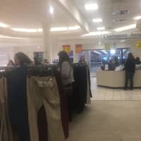 <p>Shoppers pick through what&#x27;s left on the racks -- all priced at $3.</p>