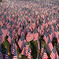 <p>The Field of Flags displayed in front of Old Main on the WCSU midtown campus in Danbury includes 7,008 flags, one for each service member killed in the War on Terror since Sept. 11, 2001.</p>