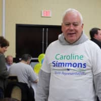 <p>Michael Feighan, a political strategist for State Rep. Caroline Simmons, wears his allegiance on his chest.</p>