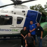 <p>Young Upper Saddle River volunteers hang out around the HUMC chopper.</p>