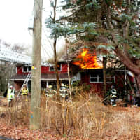 <p>Crews of Mohegan firefighters work the scene at the Buckhorn Road house fire in Shrub Oak.</p>