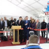 <p>Gov. Dannel Malloy cuts the ribbon for the official opening of the Rinks at Veterans Park in Norwalk.</p>