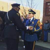 <p>Marine Veteran and Newark Capt. Gary Vickers presents Fair Lawn Capt. Robert Kneer with a noncommissioned officer sword for the final dismissal of the Teaneck and Hackensack Honor Guard at his final walk out from the department Friday.</p>