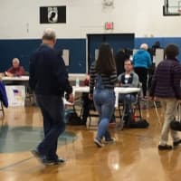 <p>Voters enter the gym at the War Memorial in Danbury to cast their ballots on Tuesday.</p>