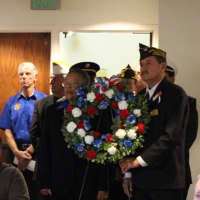 <p>Members of local veterans organizations prepare to place the memorial wreath during Veterans Day services at Westport Town Hall.</p>
