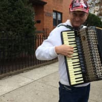 <p>Stanistaw Nestoronicz plays the accordion before the start of the annual Pulaski Day Parade in Garfield Sunday morning, Oct. 4. </p>