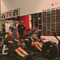 <p>Mike Mueller of the Bergen County Regional SWAT Team pictured here on middle rower. On left rower is Frank Saraceni formerly of River Vale PD, and standing back left is Brendan Brown of the West Point powerlifting team, and to his right is Rich Sadiv</p>