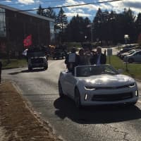 <p>Band director Damon Coachman, left, rides in the lead car with First Selectman Matt Knickerbocker and Dr. Kristen Brooks, the Assistant Superintendent of Bethel Public Schools.</p>