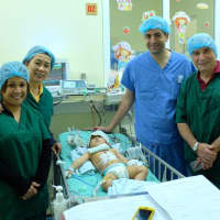 <p>Jennifer Padlina (second from the left) with other volunteers during their &quot;Gift of Life&quot; medical mission to Vietnam.</p>