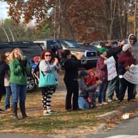 <p>Parents of students in the Bethel High School Marching Band support the band during Friday&#x27;s parade.</p>