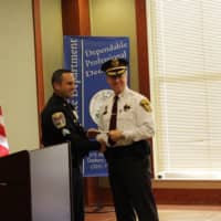 <p>Ridgefield&#x27;s Police Chief John Roche accepts a donation from the Gleszer estate on behalf of his department from Danbury Sgt. James Antonelli.</p>