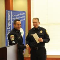 <p>Danbury Sgt. James Antonelli congratulates Bethel Police Chief Jeffrey Finch on receiving a donation from the Gleszer request to support the Bethel department&#x27;s K-9 program.</p>