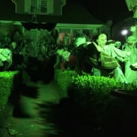 <p>Many Halloween figures fill the front yard of the Rodrigues family of Hawthorne Monday night, Oct. 12. </p>