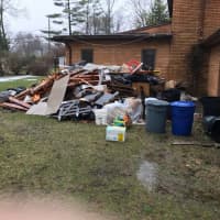 <p>Dave Dankin&#x27;s backyard still has piles of trash that he says should&#x27;ve been placed in a dumpster when WoodArt Kitchen Design began demolition on his kitchen.</p>