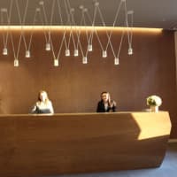 <p>Christina Cerone, left, and Isamarie Rodriquez, front office manager, are ready to greet guests at the front desk of Hotel Zero Degrees in Danbury.</p>